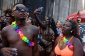 Revellers take part in the 'Chora Me Liga' block party during a pre-Carnival parade in Rio de Janeiro