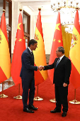 Chinese Premier Li Qiang shakes hands with Spanish PM Sanchez in Beijing