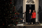 British Prime Minister Starmer and his wife switch on the Downing Street Christmas tree lights, in London