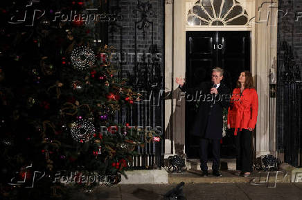 British Prime Minister Starmer and his wife switch on the Downing Street Christmas tree lights, in London