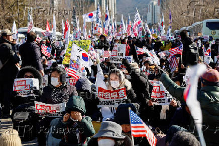 Impeached South Korean President Yoon Suk Yeol's supporters rally near the Corruption Investigation Office for High-ranking Officials, following his arrest, in Gwacheon