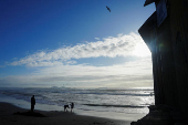 People visit the Mexico-U.S. border fence at Playas Tijuana