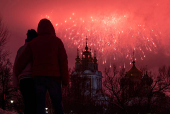 Fireworks explode behind the Novodevichy monastery amid Defender of the Fatherland Day celebrations, in Moscow