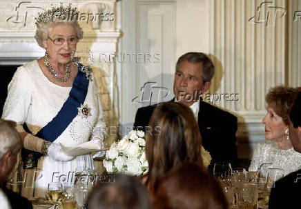 FILE PHOTO: Queen Elizabeth II makes a toast alongside U.S. President Bush at the White House in Washington