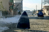 Afghans living in a camp amidst drop in temperatures in Kabul