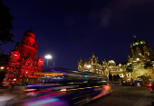 The Chhatrapati Shivaji Maharaj Terminus (CSMT) and the Municipal Corporation building are pictured, before lights were turned off for Earth Hour in Mumbai