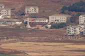 North Korean citizens walk in North Korea's propaganda village Kaepoong, in this picture taken from the top of the Aegibong Peak Observatory, south of the demilitarised zone (DMZ), separating the two Koreas in Gimpo