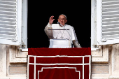 Pope Francis leads the Angelus prayer from his window, at the Vatican