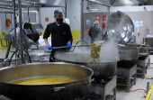 Workers prepare iftar meals to be delivered to Gaza, in Amman