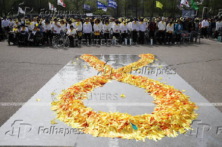 South Koreans mark the 10th anniversary of the sunken Sewol ferry that killed 304 people, mostly school students