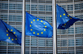 FILE PHOTO: EuropeanUnionflags fly outside theEuropeanCommission headquarters in Brussels