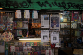 A kiosk displays newspaper headlines after the results of yesterday's elections, in Montevideo