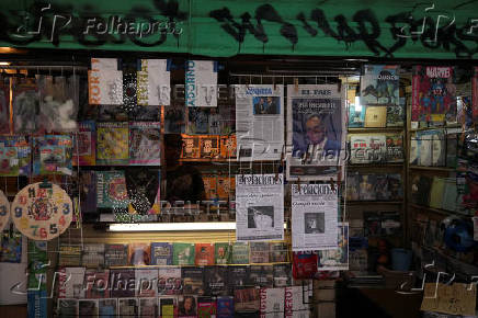 A kiosk displays newspaper headlines after the results of yesterday's elections, in Montevideo