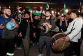 Syrian-Americans and supporters celebrate after Syrian rebels announced that they had ousted Syrian President Bashar al- Assad in Syria, in Dearborn, Michigan,