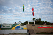 A man crosses the border towards Brazil after leaving Venezuela