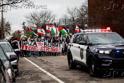 Protest in front of the residence of the University of Michigan's president, in Ann Arbor