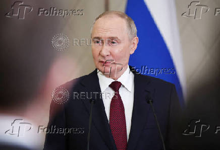 Russian President Putin attends a press conference in Astana