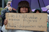 People gather to protest against the forced disappearance of four minors, in Quito