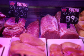 Pork meat is displayed at a market stall in Rome