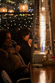 Tourists enjoy last days of gas heaters on Barcelona's terraces