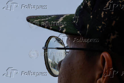 Hsiung Feng III and II mobile missile launchers are seen reflected on the glasses of a solider during Taiwanese President Lai Ching-te?s visit to a military base in response to recent Chinese military drills, in Taoyuan