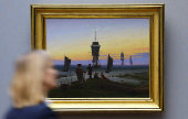 People view painting 'The Stages of Life' by German Romantic landscape painter Caspar David Friedrich in Berlin
