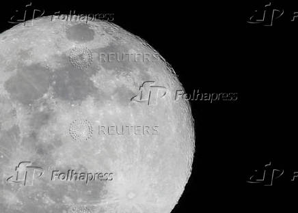 The full moon, known as the Hunter's moon, rises over Mexico City