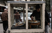 Street vendor sells sweets in downtown of Damascus