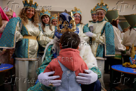 The Three Wise Men visit children and elderly people, ahead of the Epiphany parade, in Ronda