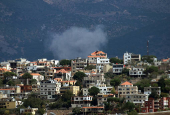 Smoke rises from the southern Lebanese village of Khiam as pictured from Marjayoun