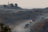 A military convoy manoeuvres inside Gaza