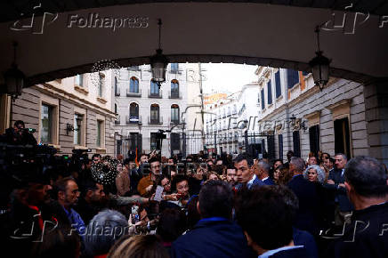 Spanish PM Sanchez talks to the media after attending a vote on a fiscal package extending a windfall tax on banks at Parliament in Madrid