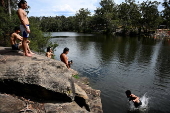 People cool off at Lake Parramatta, near Sydney