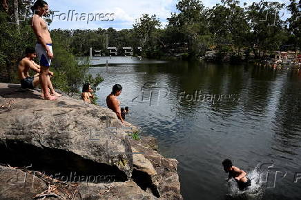 People cool off at Lake Parramatta, near Sydney