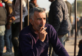 Idrees Alloush, a displaced man who fled from Tel Rifaat smokes a cigarette in Tabqa