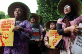 Demonstrators take part in a rally during Human Rights Day in Jakarta