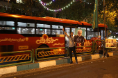 Supporters of Iranian presidential candidate Saeed Jalili hold posters of him on a street in Tehran