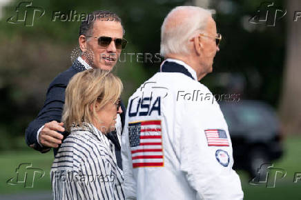 U.S. President Joe Biden wears the team USA Olympics jacket as he departs from the South Lawn of the White House