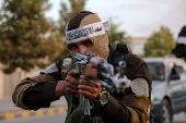 Afghans Taliban conduct checks on people and vehicles at checkpoints in Kabul