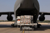 Aid for Lebanon is being loaded onto a cargo aircraft at the al-Reef Military Airport, in Abu Dhabi