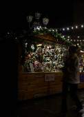 A woman walks past a stall at Chester Christmas Market