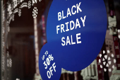 A Black Friday sales advertisement is displayed in the window of a store in the Georgetown neighborhood of Washington