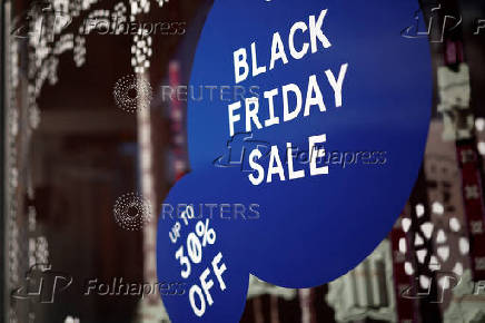 A Black Friday sales advertisement is displayed in the window of a store in the Georgetown neighborhood of Washington