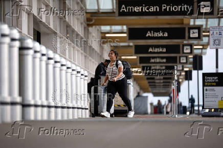 Travelers at Ronald Reagan National Airport (DCA) ahead of the Thanksgiving holiday in Arlington