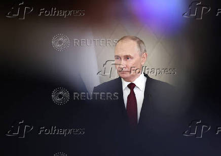 Russian President Putin attends a press conference in Astana