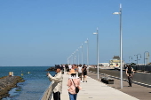 People relax on Melbourne St Kilda beach