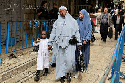 Palestinians hold Friday prayers during Ramadan at Jerusalem's Al-Aqsa compound