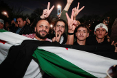 Syrian-Americans and supporters celebrate after Syrian rebels announced that they had ousted Syrian President Bashar al- Assad in Syria, in Dearborn, Michigan,