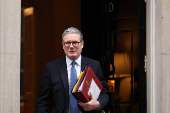 British Prime Minister Keir Starmer walks outside 10 Downing Street in London