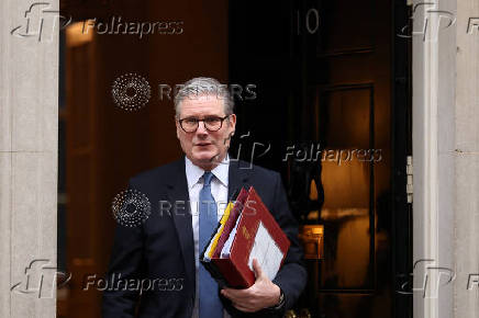 British Prime Minister Keir Starmer walks outside 10 Downing Street in London